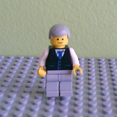 LEGO Minifigure-Black Vest with Blue Striped Tie, Light Bluish Gray Legs, White Arms, Light Bluish Gray Male Hair, Smile-Town-TWN041-Creative Brick Builders